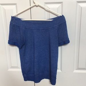 Off the shoulders blue shirt.